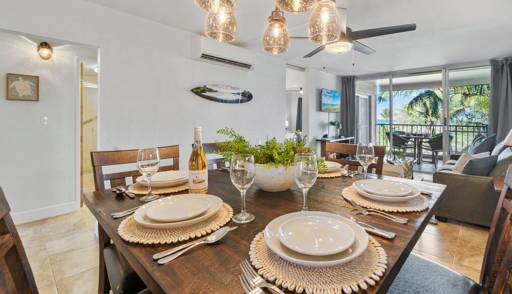 A charming dining nook features coastal-inspired lighting and decor.