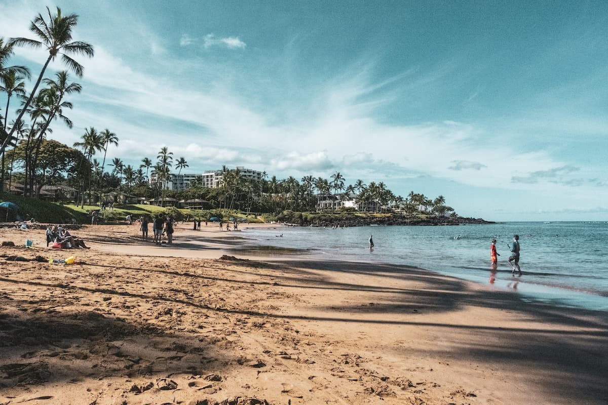 People walking over the Haleakalā Crater  along Wailea Beach which is free to visit and an affordable day out on Maui