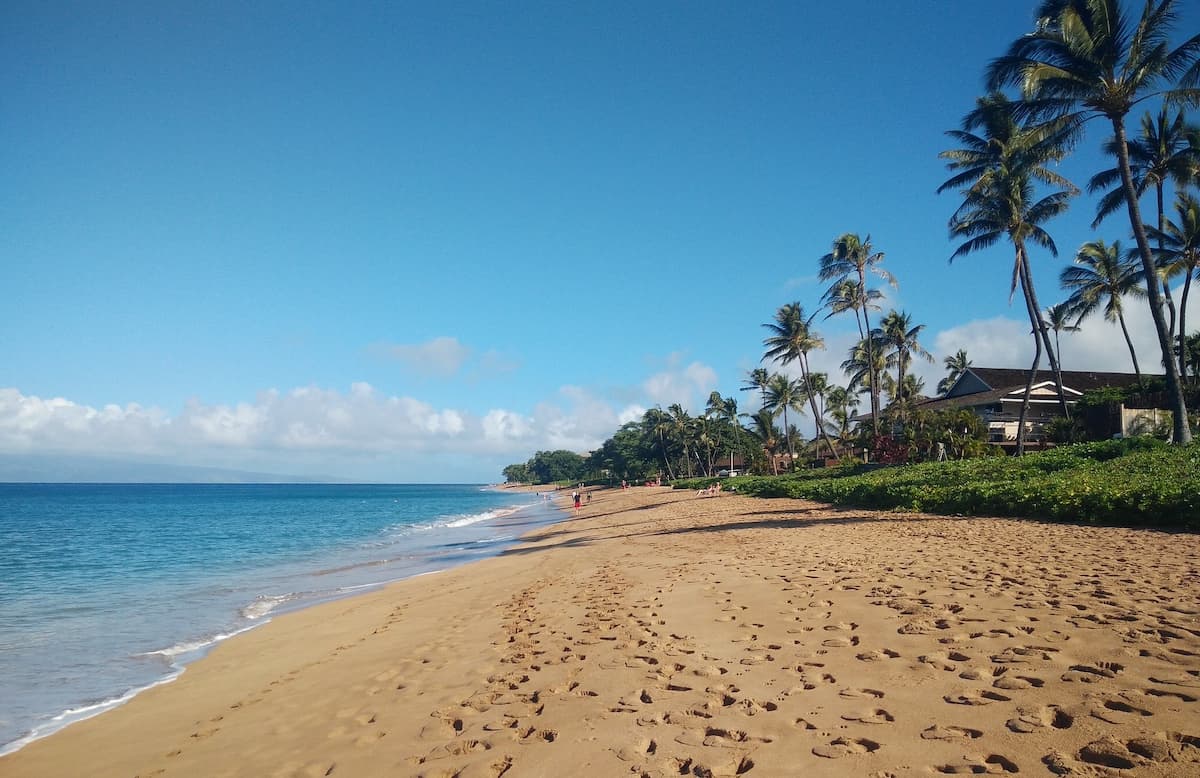 Footsteps in the sand at Kaʻanapali Beach in Maui